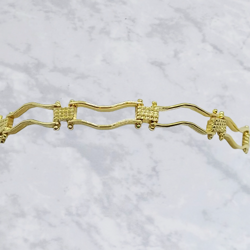 Pulsera boleada ondulada en chapa de oro 22 k