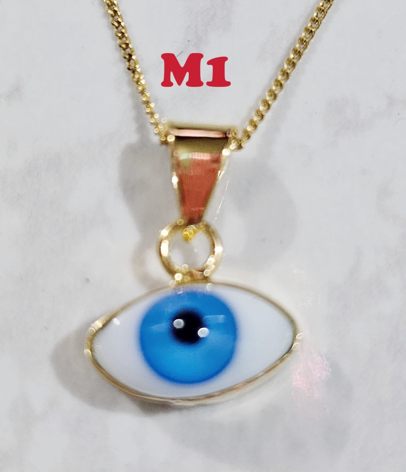 Dije de ojo varios colores en Chapa de Oro 22k