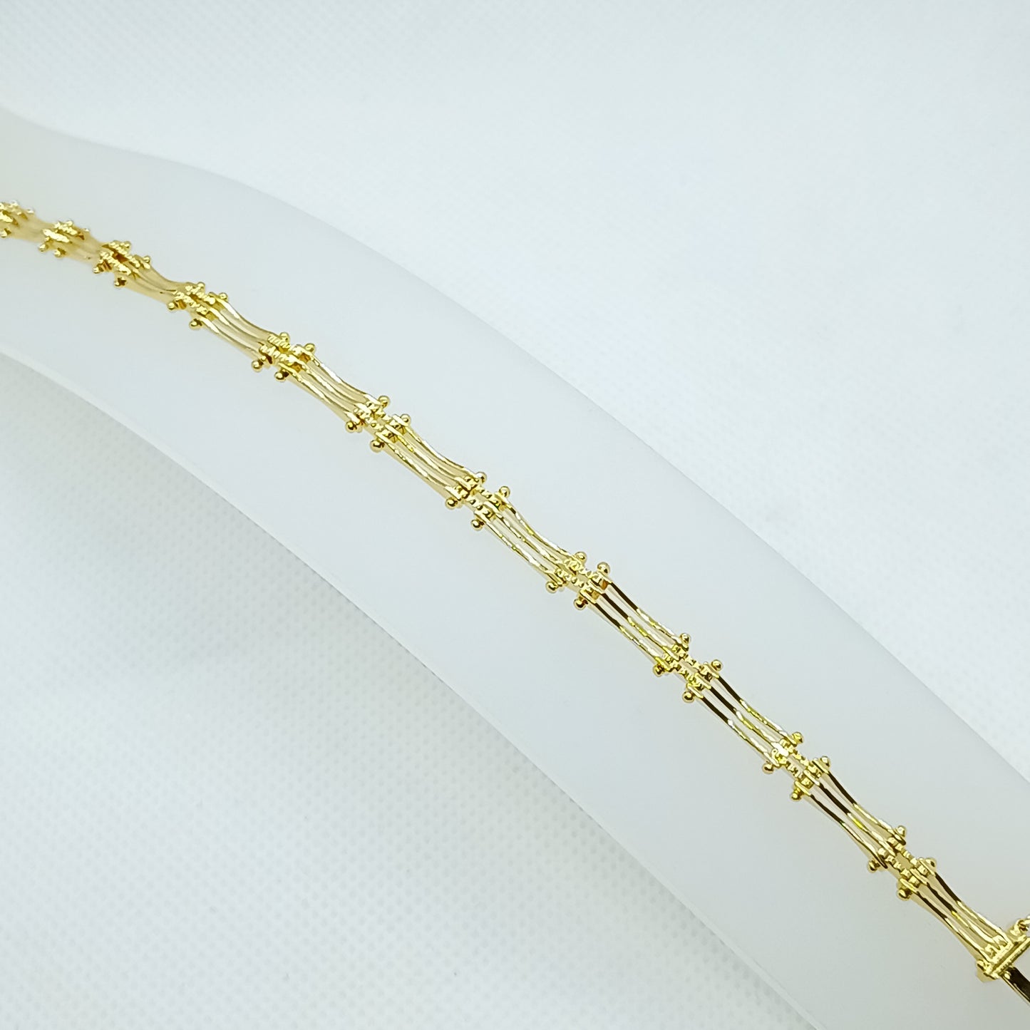 Pulsera estilo boleado en chapa de oro 22k