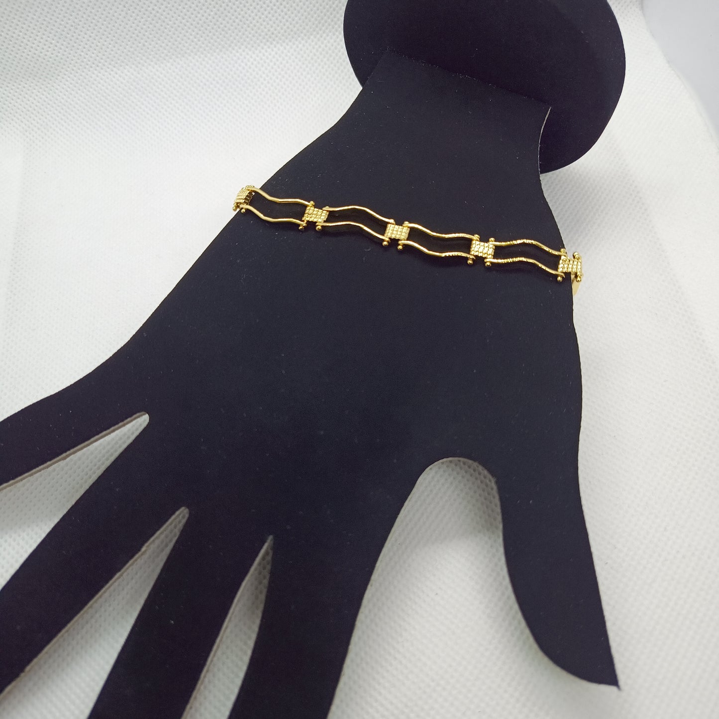 Pulsera boleada ondulada en chapa de oro 22 k