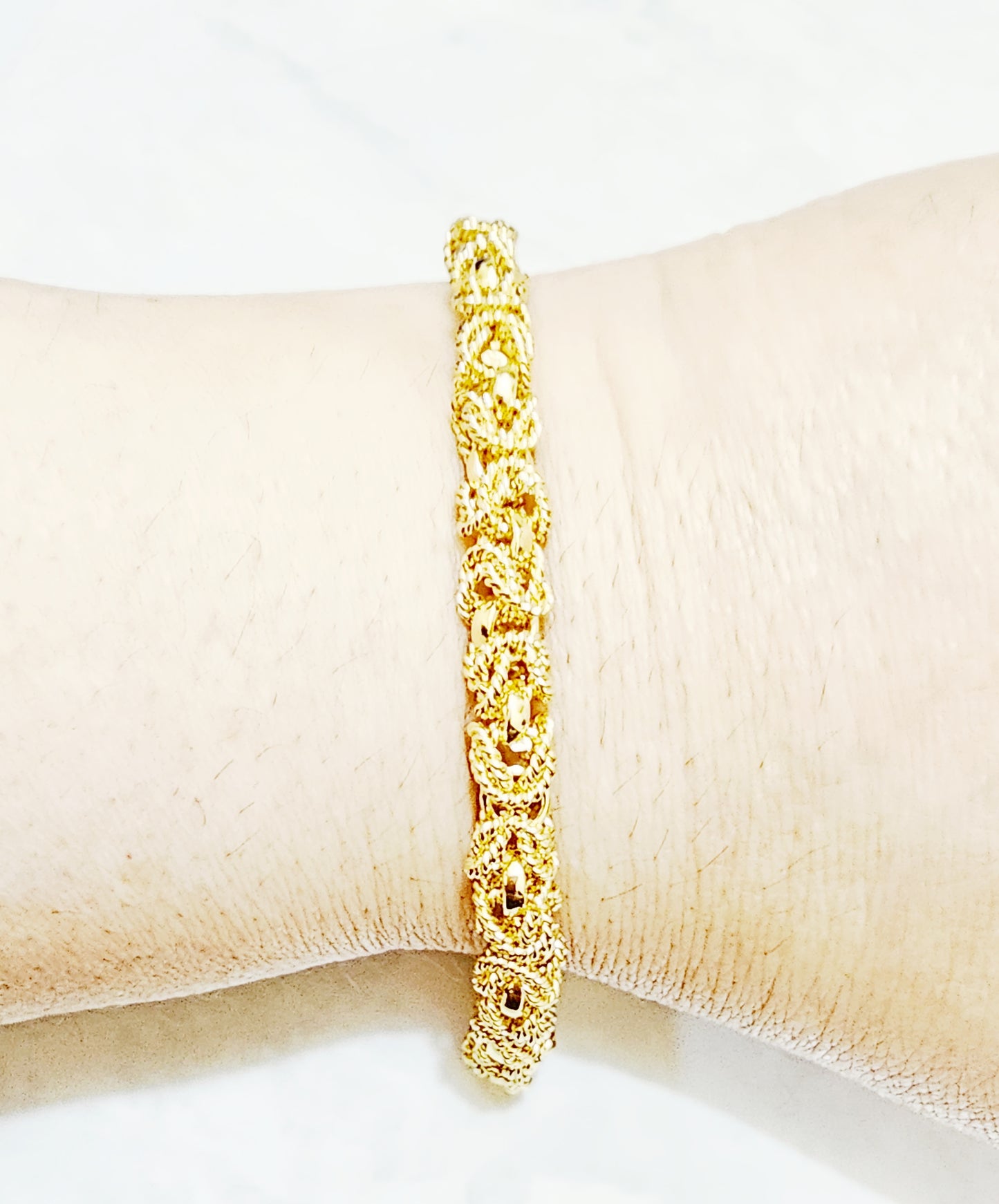 Pulsera tejida en chapa de oro de 22kts